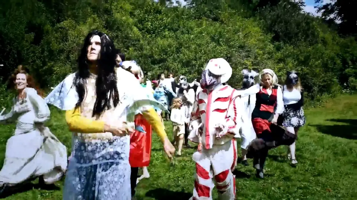 Costumed revellers celebrating at the fête near Stroud
